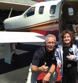 Ray Chester flying a young Wings of Mercy patient