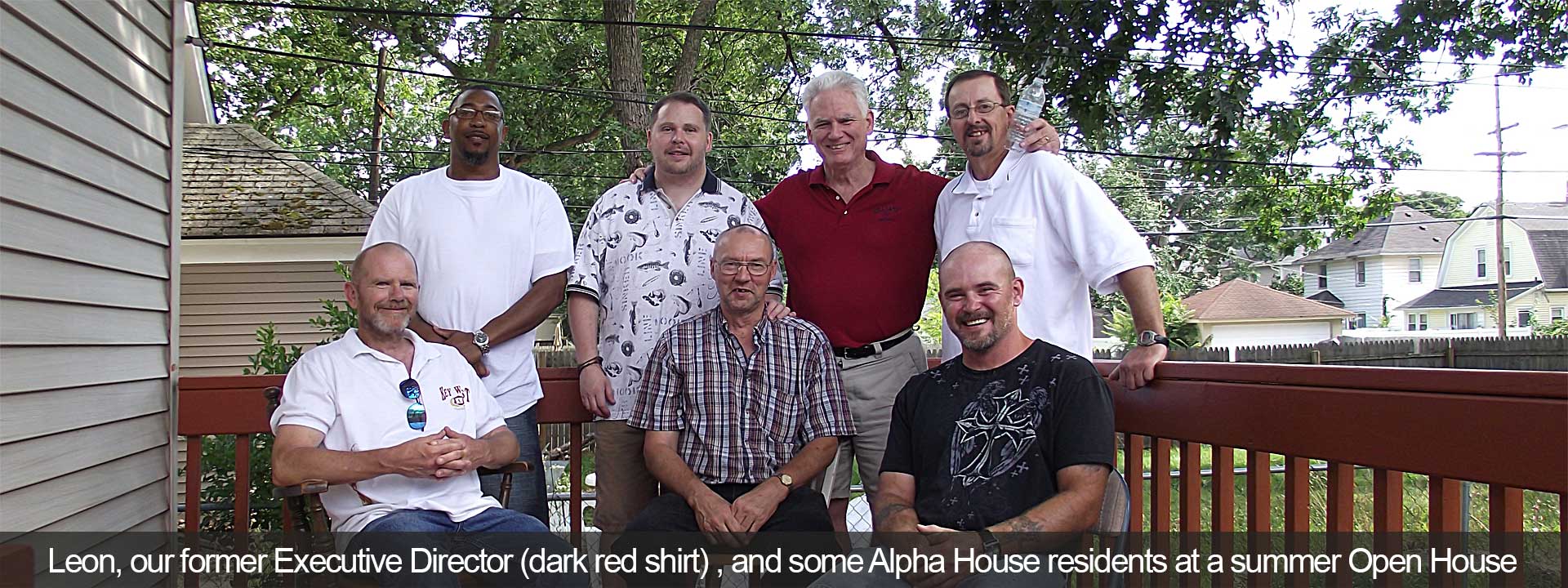 Leon, our Exective Director (dark red shirt) , and some Alpha House residents at a summer Open House